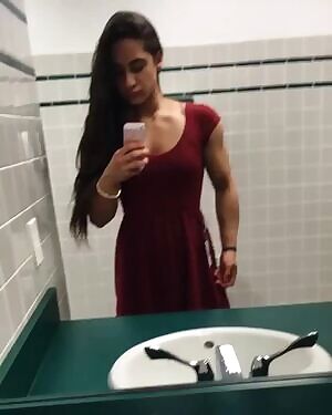 Girl flexing in a dress