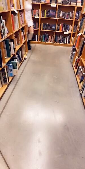 Busty petite at the bookstore