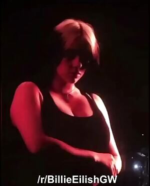 Billie Eilish puts her massive tits on display